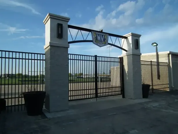 Meadow Valley High School entrance gate with football field beyond