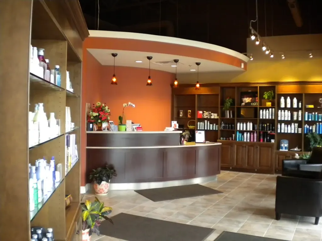 Hair salon interior with product shelving and reception desk